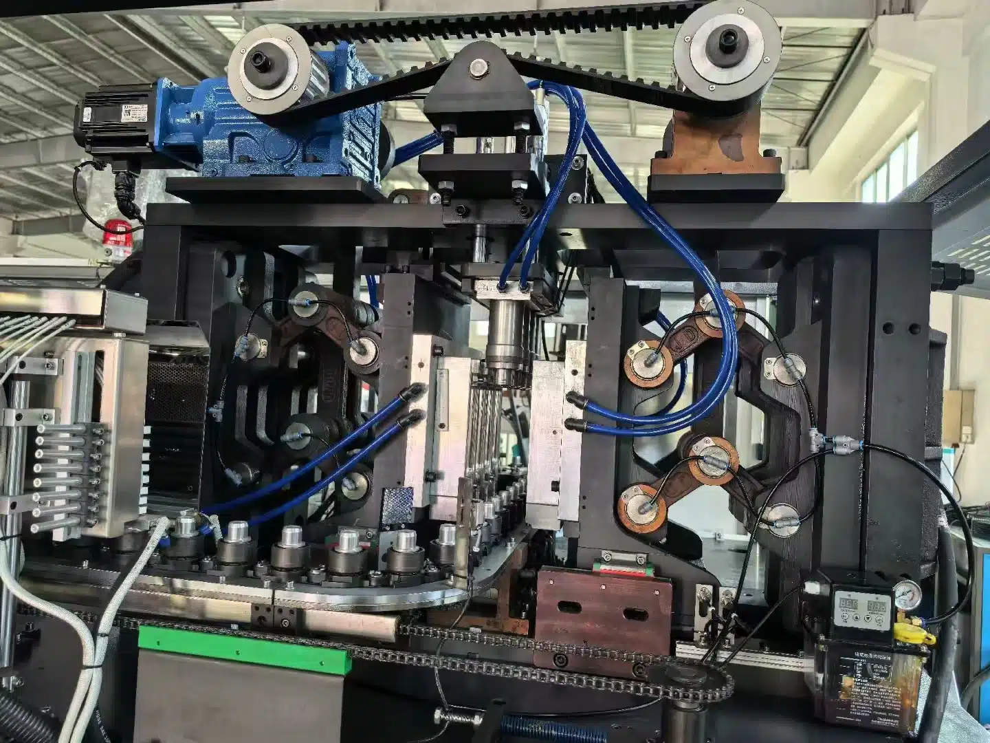 A Blow Mold With Clearly Visible Cooling Channels, Connected To A Water Chiller.