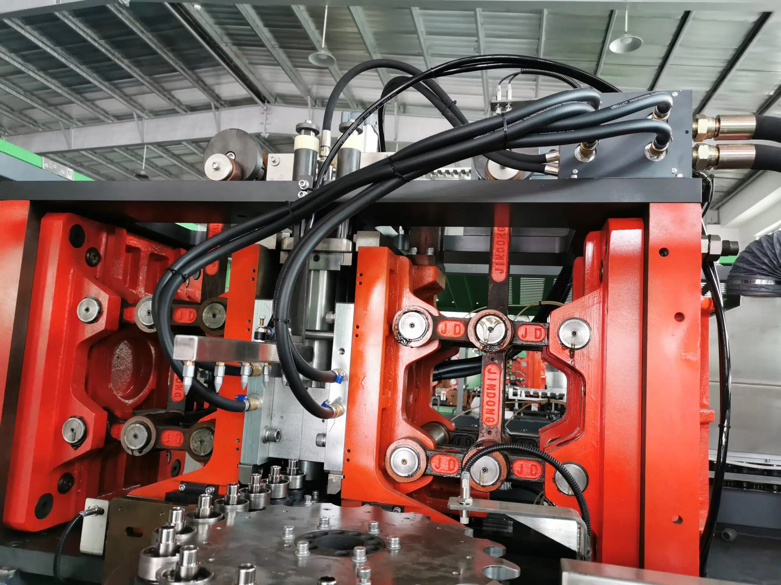 A Close-Up Of A Mold Clamping System On A Blowing Machine.