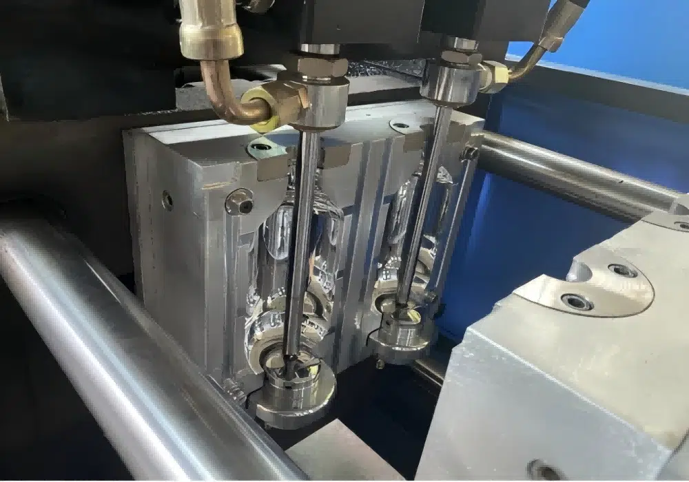 Adjusting The Stretch Rod On A Blow Molding Machine
