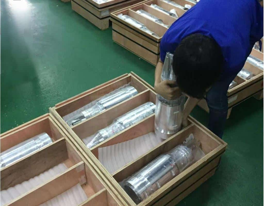 A Crated Pet Mold Being Loaded Into A Shipping Container