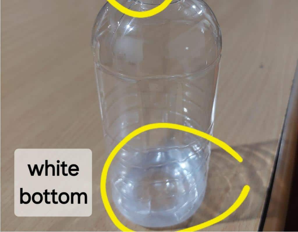A Side-By-Side Comparison Of A Defective Bottle And A Good Bottle, With Arrows Pointing To The Flaws.