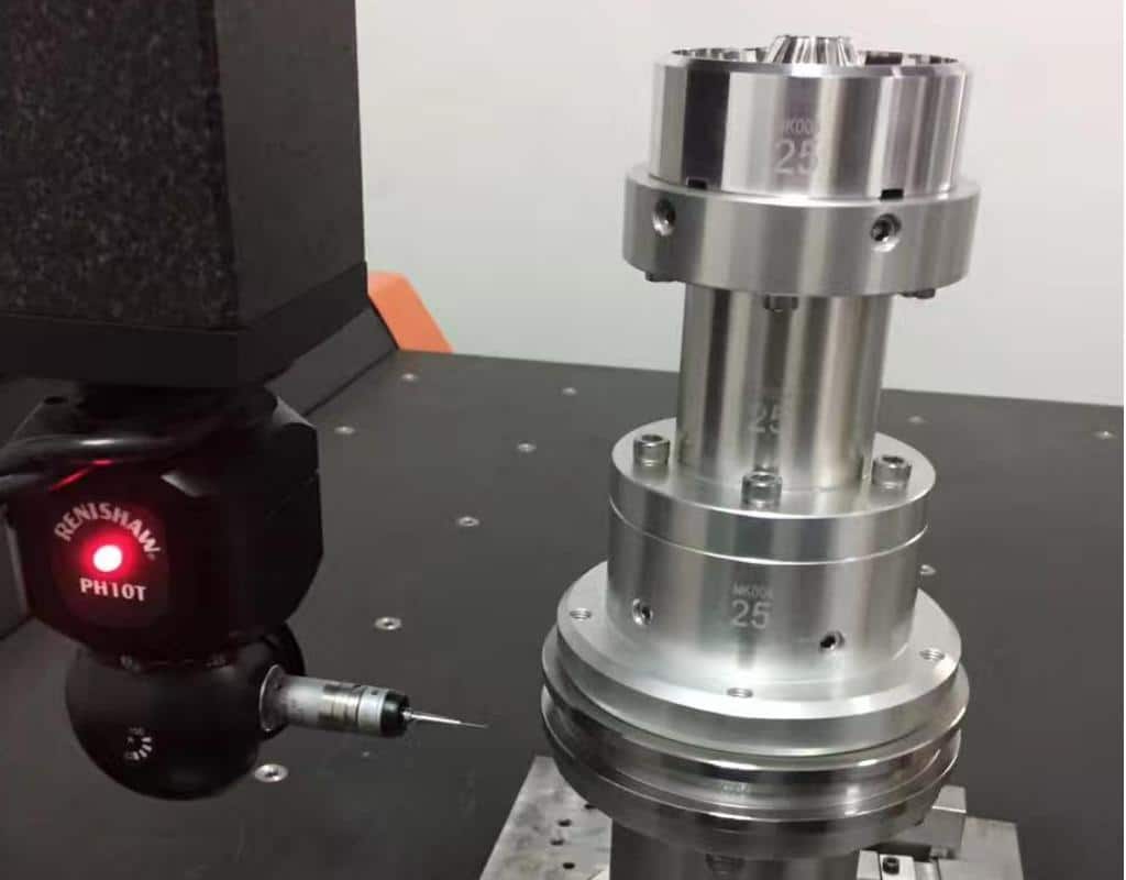 A Precision Measuring Tool, A Cmm Arm, Touching A Blow Mold Base Insert To Verify Dimensions.