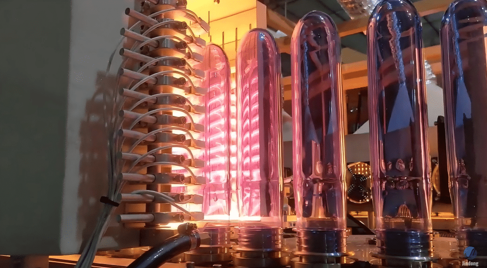 A Pet Preform Being Heated In A Blow Molding Machine