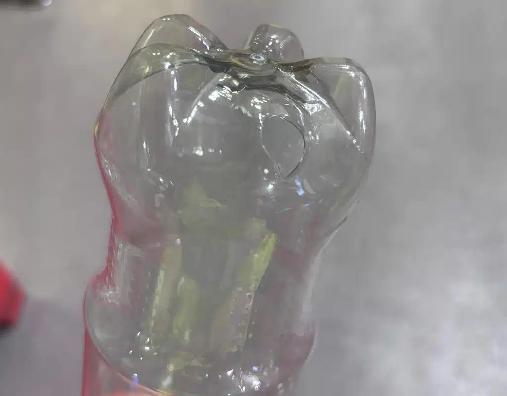 An Animation Showing A Small Preform Trying To Blow Into A Very Large Bottle Mold And Bursting