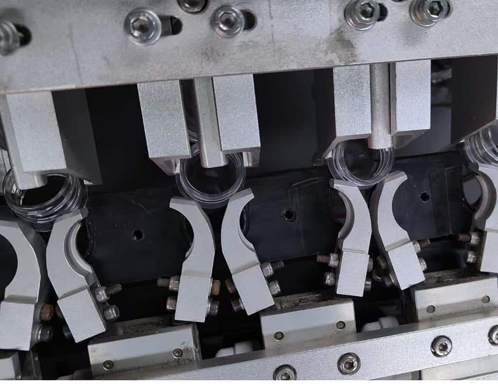 A Preform Loader For A High-Speed Machine, With A Preform Stuck At The Entrance To The Heating Mandrel.